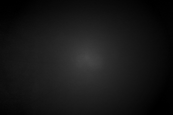 Light shining down on black metal wall in dark room with copy space, abstract background - Fotoğraf, Görsel