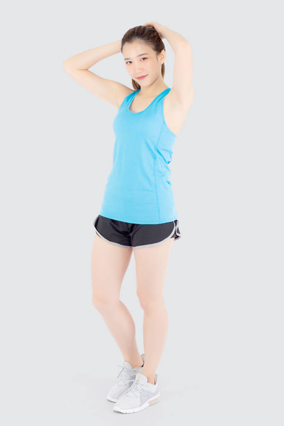 Beautiful portrait young asian woman standing workout stretch mu - Photo, Image