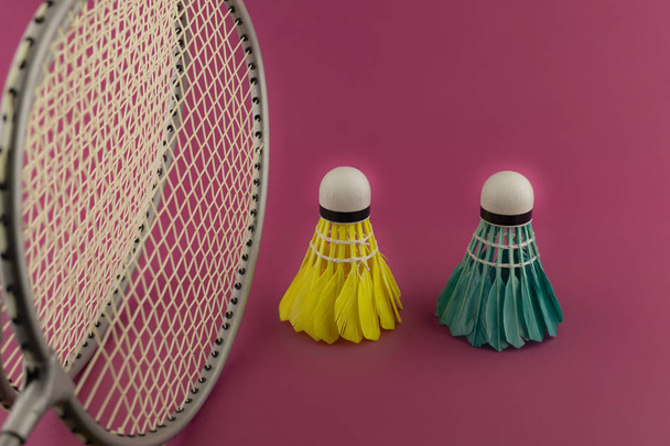 Badminton rackets and feathered shuttlecocks - Photo, Image