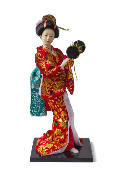 Geisha figurine in kimono with drum, isolated - 写真・画像