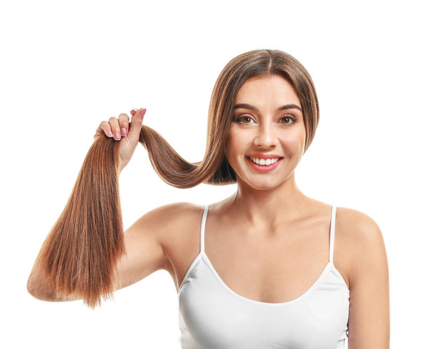 Mulher bonita com cabelos longos saudáveis no fundo branco
 - Foto, Imagem