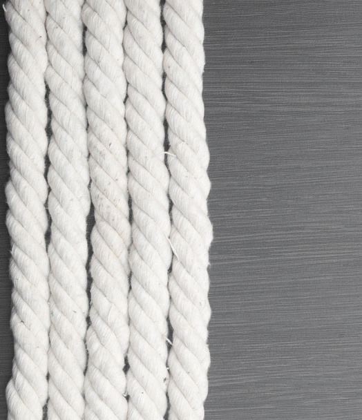 White rope on black background - Foto, afbeelding