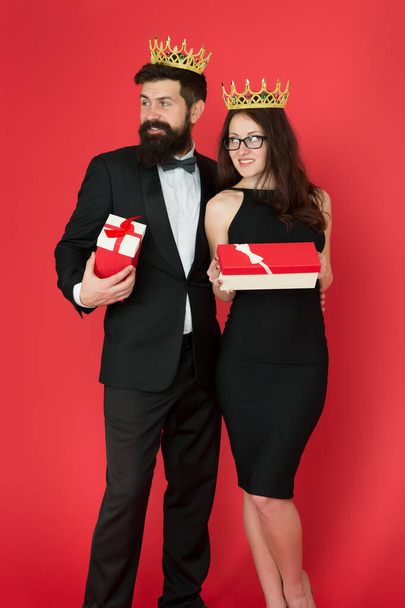 Welcome to world of luxury. King and queen hold gift boxes. Successful couple wear luxury crowns. Rich man and woman got reward. Luxury lifestyle. Expensive lux presents. Shop for best luxury gifts - 写真・画像