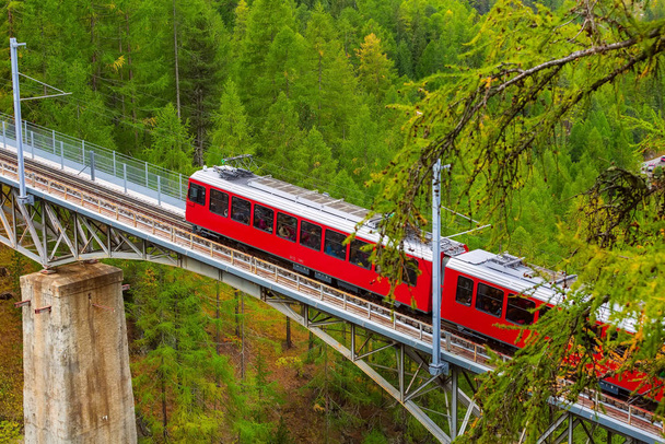 Zermatt, Switzerland. Gornergrat train on bridge - Photo, Image