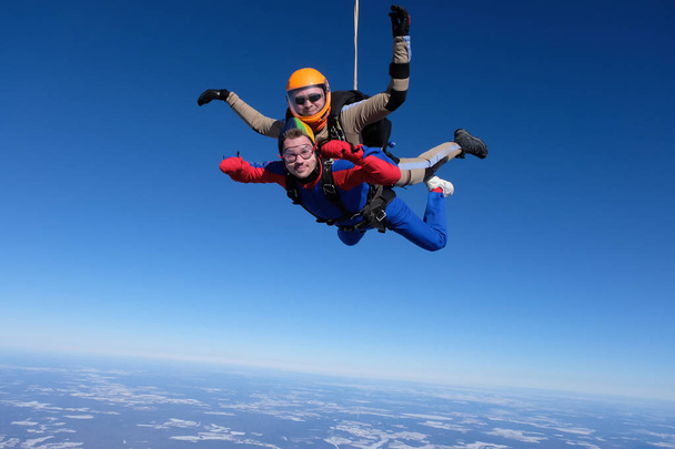 Skydiving. Tandem jump. Two guys are in the sky. - Photo, Image