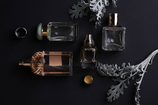 beautiful aroma perfumes set on dark background  - 写真・画像