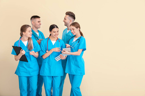 Group of medical students on light background - Photo, Image