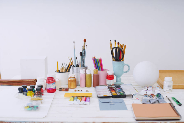 Workspace of designer illustrator with materials and equipment, Freelance creative concept   - 写真・画像