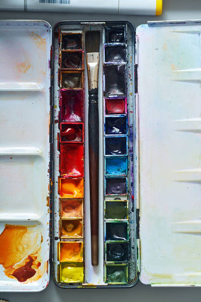 Set of watercolor paints of professional artist with blots and traces  - 写真・画像