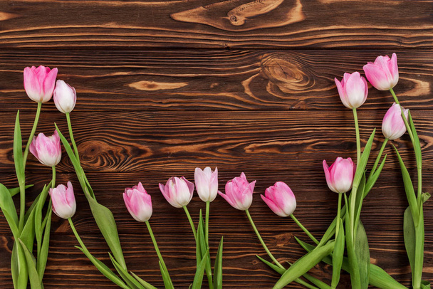 Beautiful tulips on rustic wooden background - Fotografie, Obrázek