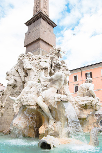 statues on Fountain of Four Rivers and obelisk in Rome, Italy - Fotoğraf, Görsel