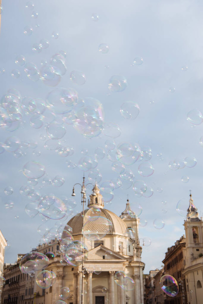 obelisk at piazza del popolo (peoples square) and soap bubbles in Rome, Italy - Foto, Imagen