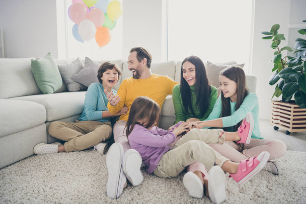 Nice attractive lovely charming cheerful cheery positive family three pre-teen kids playing having fun at cozy light white interior style house flat apartment living-room indoors - Fotoğraf, Görsel