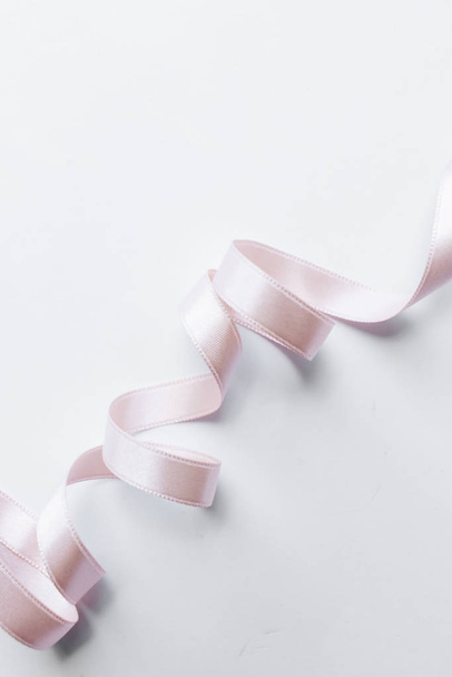 light pink ribbon decoration on white background - Photo, image