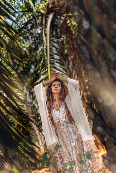 fashion boho woman at natural tropical background - Fotó, kép