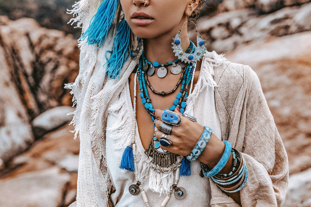 beautiful young woman in tribal costume with primal ornamet  - Foto, Imagen