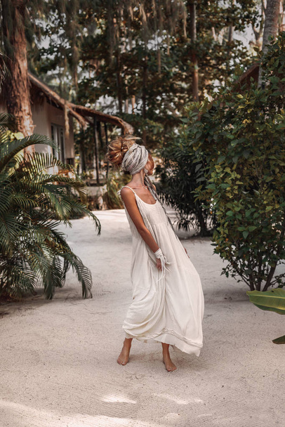 beautiful young bohemian woman at natural tropical resort - Zdjęcie, obraz