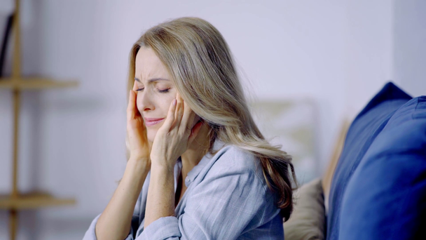 woman having headache and touching head  - Footage, Video