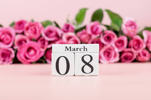 Pink Rose flower and 8th March calendar on pink background with  - Fotoğraf, Görsel
