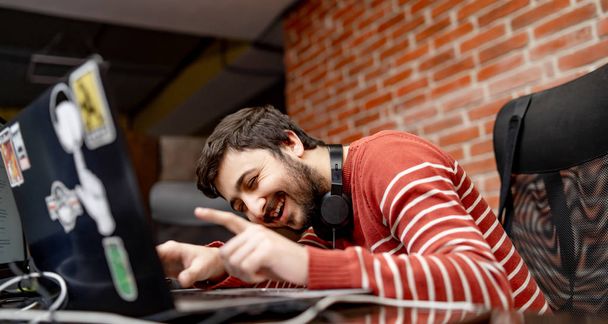 Programmer working in a software development company office - Photo, Image