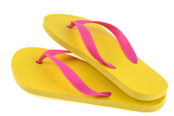 Colored flip flops in close-up on white background - Foto, imagen