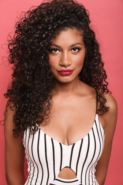 Image of pretty african american woman with curly hair looking a - Foto, Bild