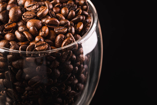 a big jar full of coffee beans, isolated on black with clipping path. - Valokuva, kuva