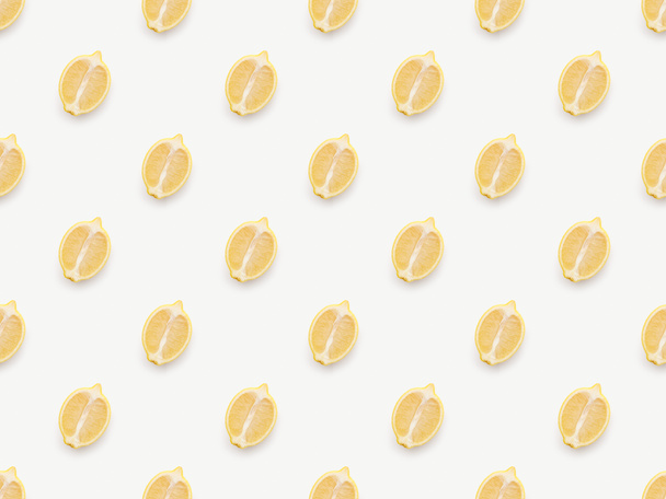 Top view of lemons halves on white background - Foto, Imagem