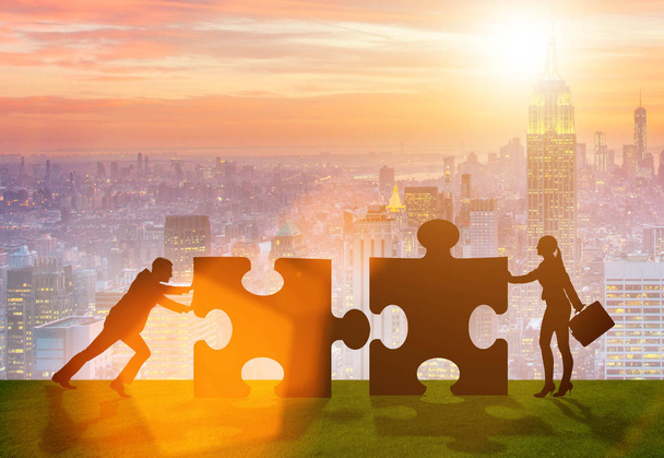 Business metaphor of teamwork with jigsaw puzzle - Photo, Image