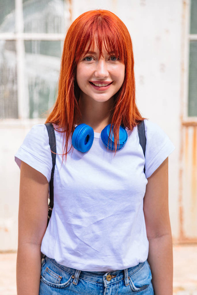 Close up portrait of girl with large headphones - Foto, afbeelding