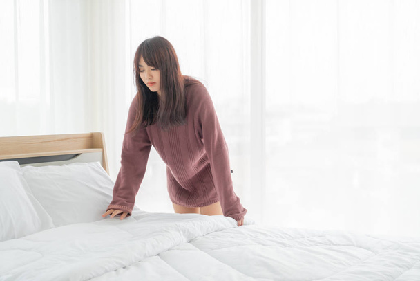 Asian women making bed in room with white clean sheet - Photo, Image