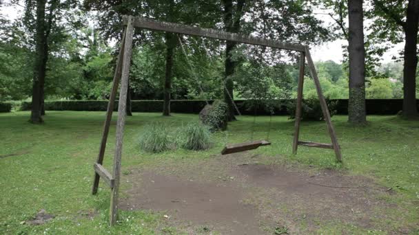Empty swings swaying - Footage, Video