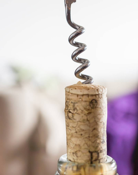 Closeup shot of a corkscrew on a cork - Valokuva, kuva