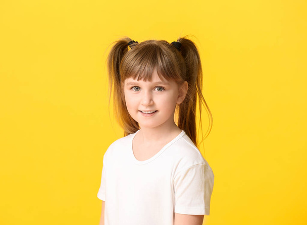 Cute little girl on color background - Photo, Image