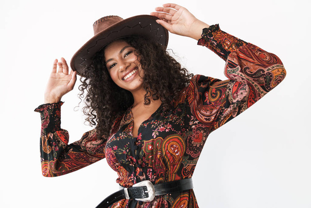 Beautiful cheerful young woman wearing cowboy hat - 写真・画像