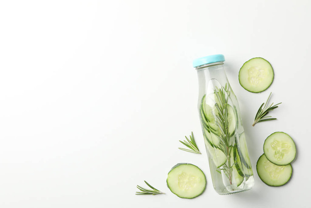 Bottle with infused cucumber water on white background, space fo - Photo, image
