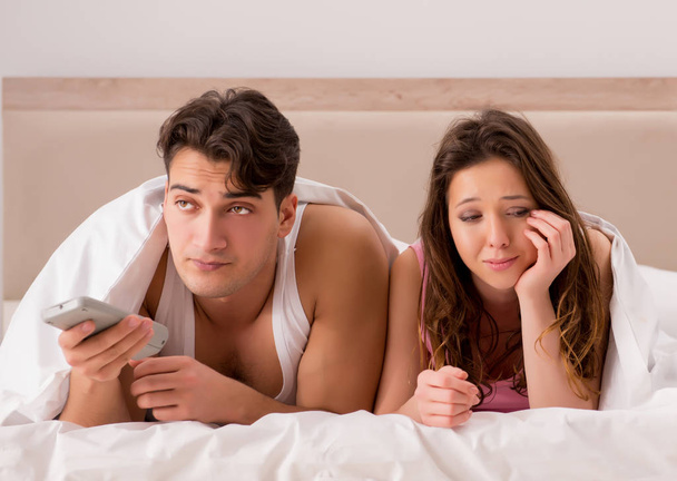 Family conflict with wife husband in bed - Foto, Imagen