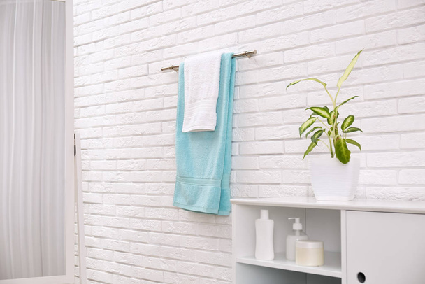 Fresh clean towels on hanger in bathroom - Foto, Imagem