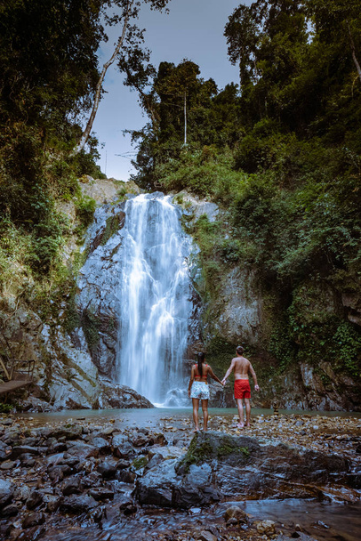 A tourist is enjoying the beauty of the waterfall in Chumphon province, Thailand , Klongphrao waterfall Thailand - Fotoğraf, Görsel