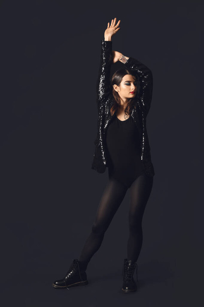 Beautiful fashionable woman on dark background - Fotografie, Obrázek