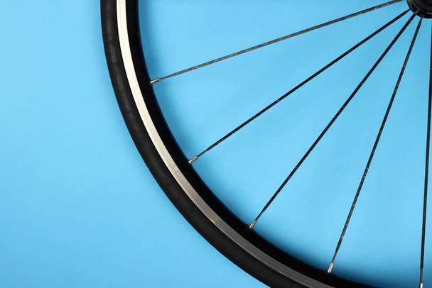 road bike wheel on a blue background - Photo, Image