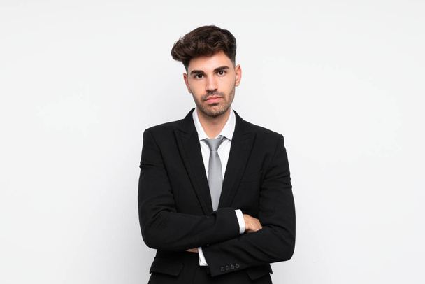 Jeune homme d'affaires sur fond blanc isolé gardant bras croisés
 - Photo, image