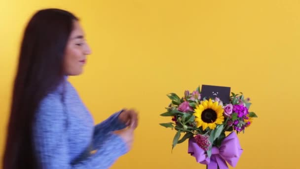 Cute Latin girl appreciating the sorry bouquet - 映像、動画