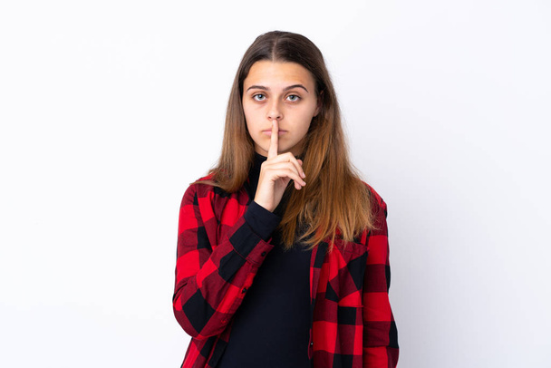 Έφηβος κορίτσι πάνω από απομονωμένο λευκό φόντο δείχνοντας ένα σημάδι της σιωπής χειρονομία βάζοντας το δάχτυλο στο στόμα - Φωτογραφία, εικόνα