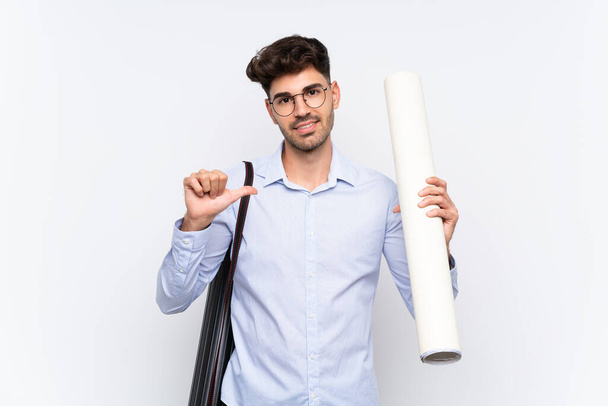 Young architect man over isolated white background proud and self-satisfied - Φωτογραφία, εικόνα