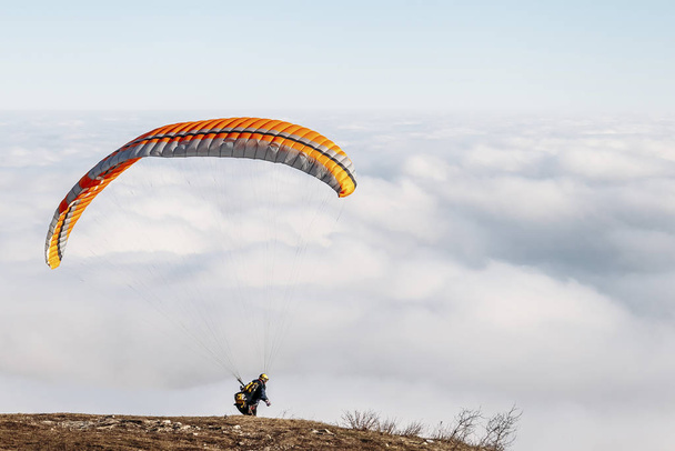 paraglider starting to paragliding above mountain - Fotoğraf, Görsel
