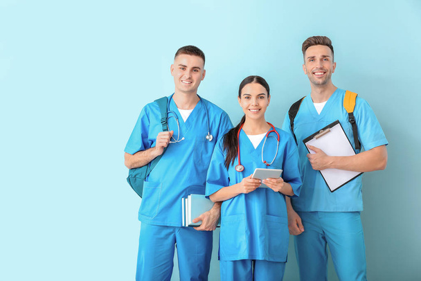 Group of medical students on color background - Photo, Image