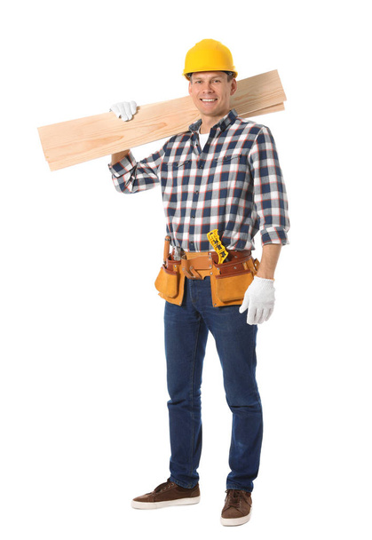 Handsome carpenter with wooden planks isolated on white - Foto, imagen