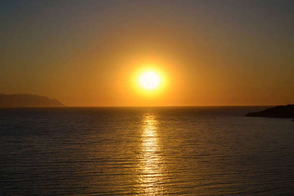 Beautiful Golden Sunset over the Sea .Sea Landscape with Orange Sun  - Photo, image