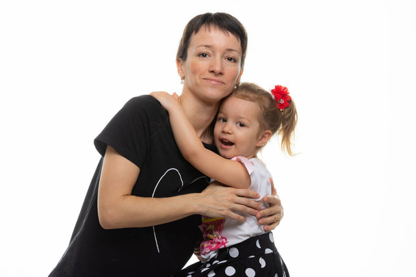 Mom and daughter hugged each other, isolated on a white background - Photo, Image